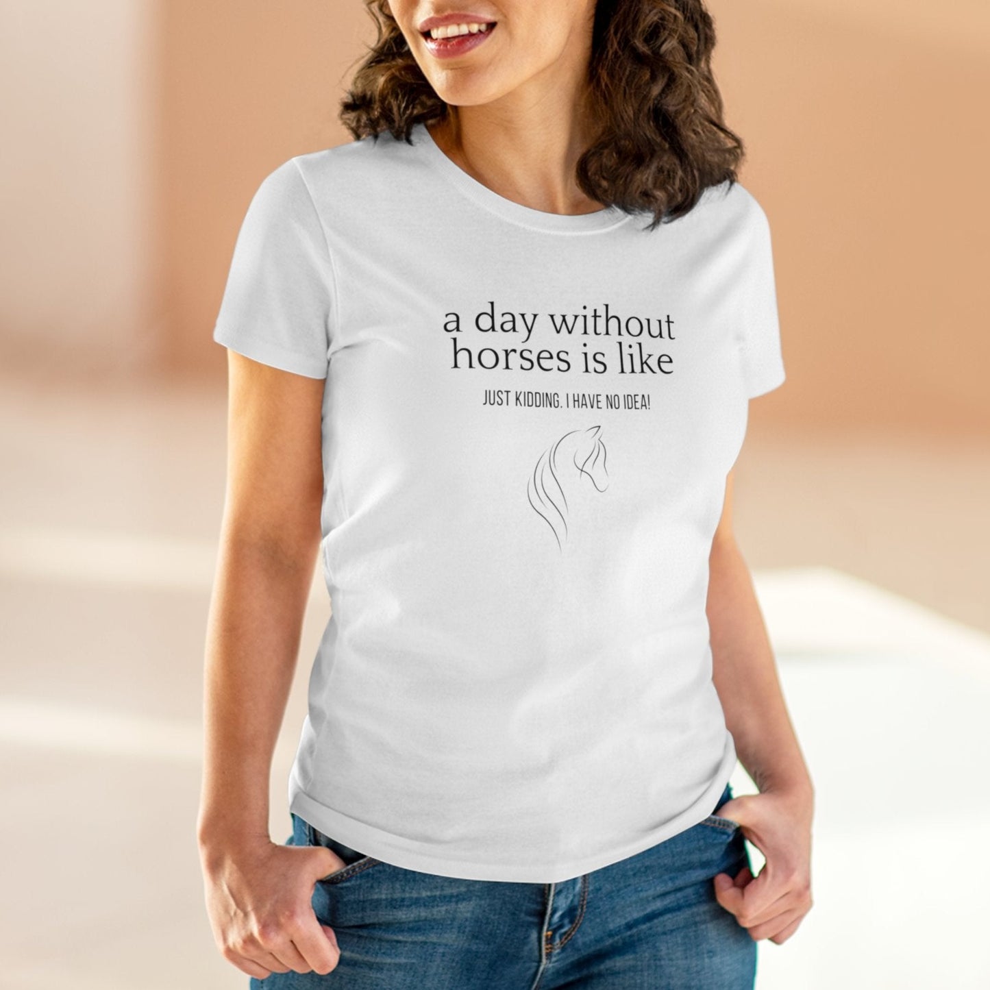 Close-up of woman wearing a horse t-shirt with the slogan 'A day without horses is like - just kidding. I have no idea