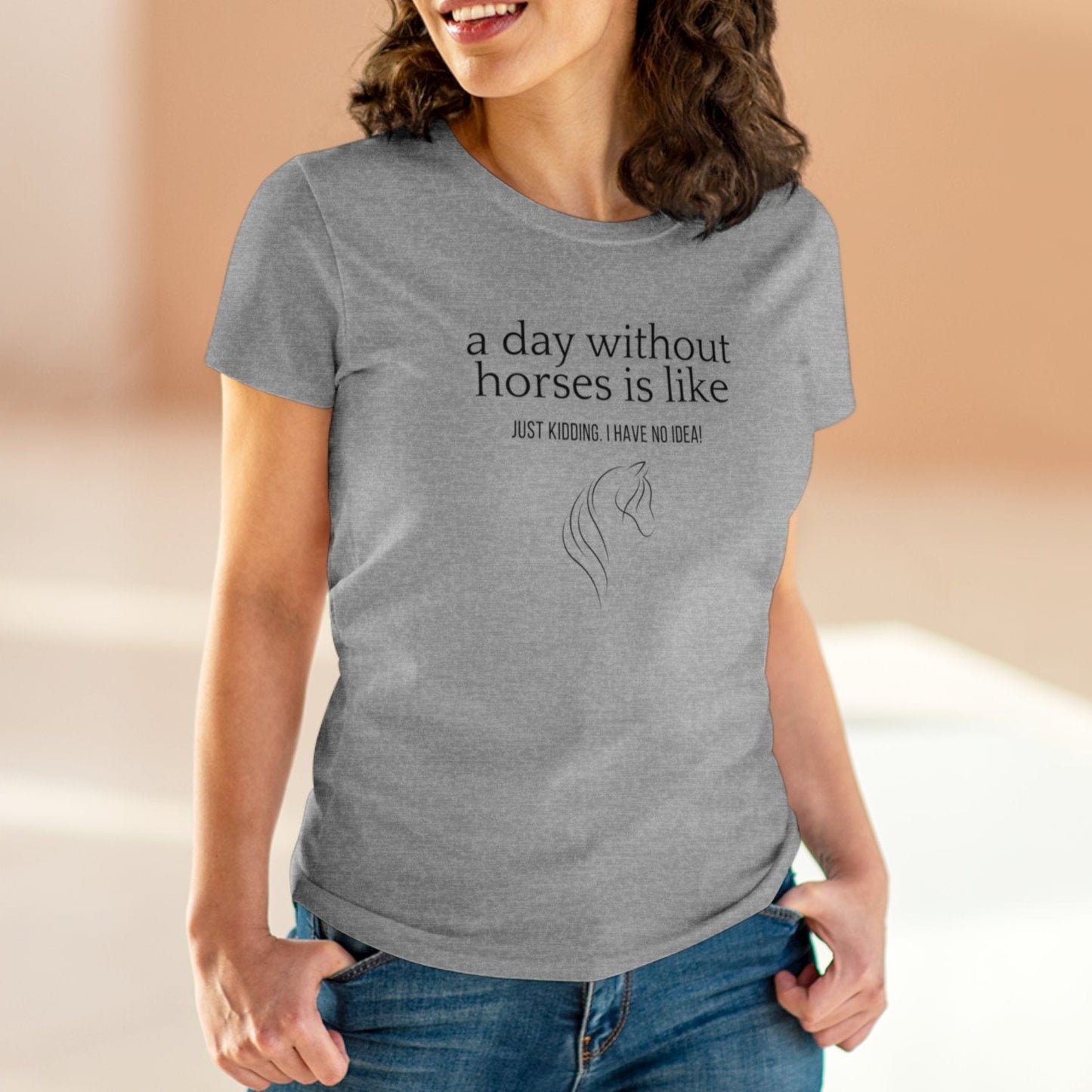 Close-up of woman wearing a horse t-shirt with the slogan 'A day without horses is like - just kidding. I have no idea