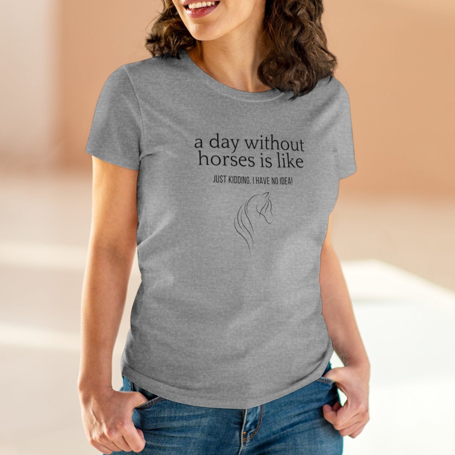 Close-up of woman wearing a horse t-shirt with the slogan 'A day without horses is like - just kidding. I have no idea